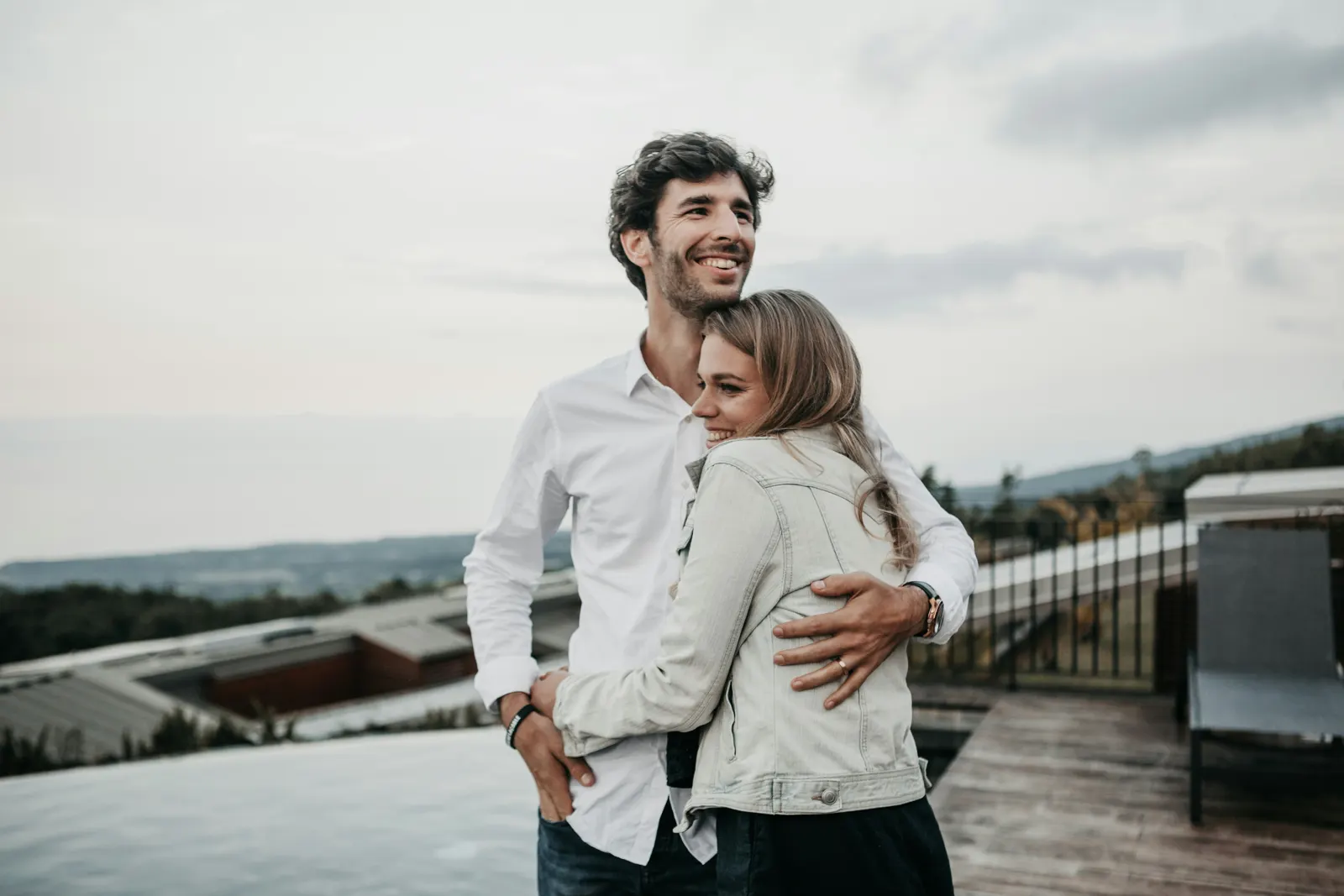 Couple embracing on a rooftop terrace